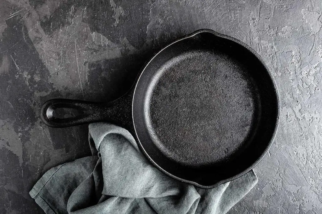 how to clean crud off a cast iron skillet