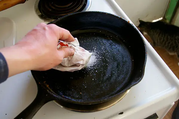 How to clean black residue off cast iron skillet